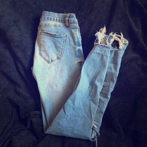 Destroyed mid waist, medium washed jeans